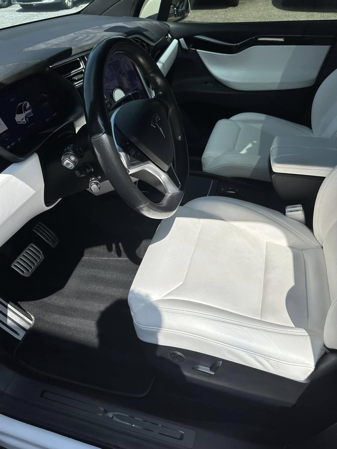 Spotless white-leather Tesla interior detailed by Reiter Auto Detailing
